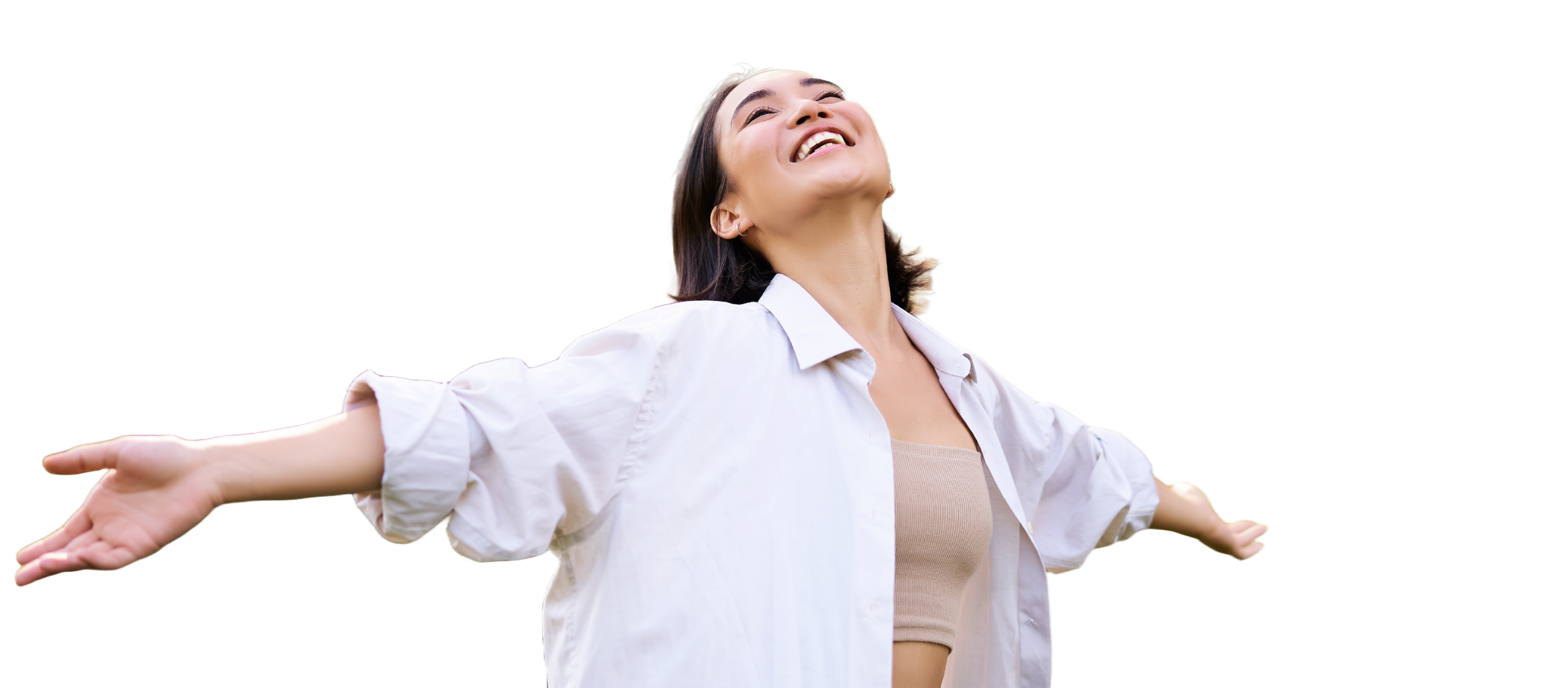 Woman with arms outstretched looking up at the sky